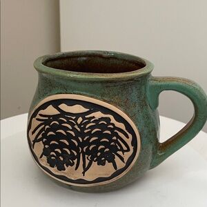 Artisan Green Ceramic Mug with Pinecone Motif